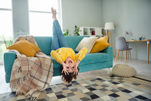 Full Length Portrait Of Cheerful Careless Person Fingers Make Binoculars Lying On Couch Barefoot Upside Down Cozy House Indoors