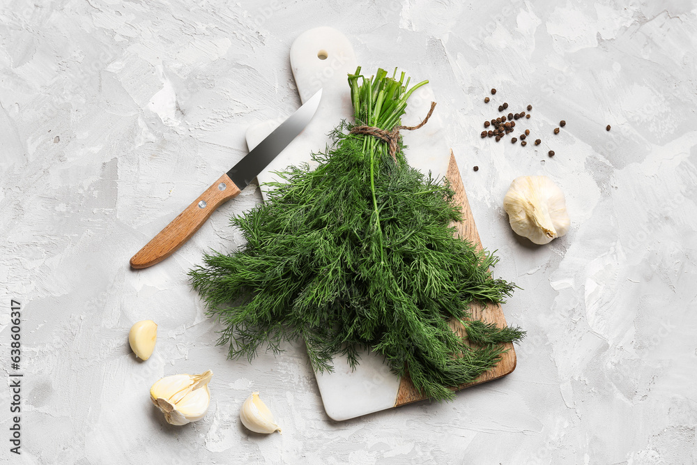 Composition with fresh dill, garlic and peppercorns on light background