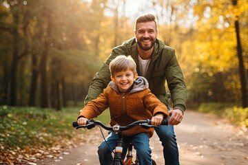 Wall Mural - Happy father teaches child son to ride bike.