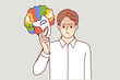 © drawlab19 - Angry man takes off mask happy clown for concept of duplicity and hypocrisy person pretending to be jester. Metaphor bipolar disorder in guy demonstrating hypocrisy when communicating or working