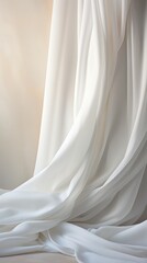Flawless white surface draped with soft white fabric. Still life photography and minimalist composition