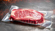 © Uuganbayar - Fresh raw beef ribeye steak sealed in a vacuum pack, preserving its quality and freshness