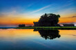 Silhouette of Tanah Lot temple in golden sunset it the most attraction and travel destination of Bali, Indonesia.
