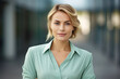 © aicandy - Confident Business Woman in Elegant Mint Green Shirt Dress Poses Gracefully for the Camera