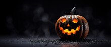 Carved Out Glowing Orange Halloween Pumpkin Jack O Lantern On Black Background With Copy Space
