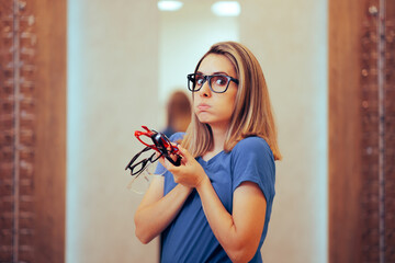 Wall Mural - Funny Woman Holding Different Frames of Eyeglasses. Undecided girl holding many glasses in optical store
