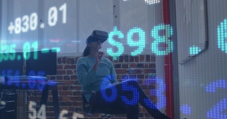 Poster - Animation of trading board over caucasian woman sitting on chair and using vr headset in office