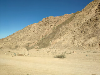 Desert land with mountains and sea