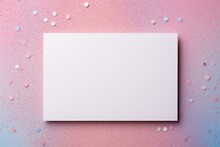 White Greeting Card Over Scattered Colorful Sequins And Confetti On Isolated Light Pink Background With Blank Space. Mockup Template. Flat Lay, Top View With Plase For Text