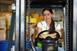 © offsuperphoto - female worker driving a forklift and prepare for work in the warehouse storage