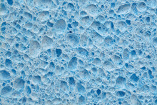 Blue Sponge Texture Background For Design. Top View Of Pores And Sponge Tissue. 