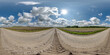 360 hdri panorama on wet gravel road with marks from car or tractor tires with clouds on blue sky in equirectangular spherical  seamless projection, skydome replacement in drone panoramas