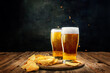 Two glasses of foamy, chill, lager beer with chips appetizers on wooden table against dark background. Concept of beer, brewery, holidays and vacation, traditions, festival, alcohol drink, ad