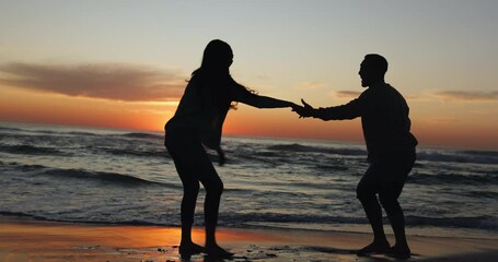 Poster - Sunset, dancing and couple on a beach for holiday or tropical vacation together for love or care on island. Silhouette, man and woman with happiness on anniversary with travel freedom at ocean