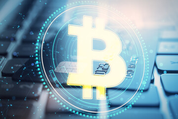 Fototapete - Close up of laptop keyboard and bank card with glowing blue polygonal bitcoin hologram on blurry background. Cryptocurrency and financce concept. Double exposure.