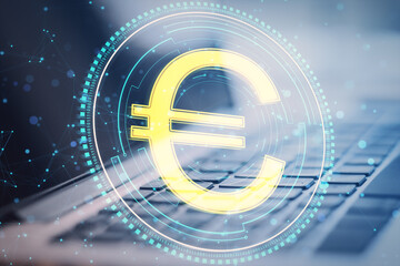 Poster - Close up of laptop computer with creative round euro coin and polygonal mesh hologram on blurry background. Digital money and finance concept. Double exposure.