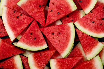 heap of fresh sliced watermelon as textured background