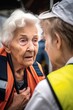 shot of a volunteer assisting an elderly woman during disaster relief