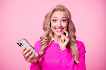 Poster - Photo of lovely pretty adorable girl wavy hairstyle finger touch lips dressed stylish jumper isolated on pink color background