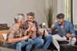 © ADDICTIVE STOCK CORE - Men drinking beer and celebrating victory at home