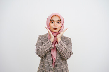 Wall Mural - Image of excited young muslim businesswoman pink hijab standing isolated over white background. Looking camera.