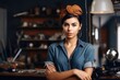 © OMD - shot of an attractive young woman standing alone in her workshop and holding a fashion accessory