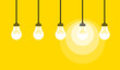 Vector illustration of white light bulbs hanging on wires on a yellow background. One of them is lit, symbolizing ideas and creativity. (EPS 10)