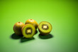 canvas print picture - Kiwi fruit on a solid color background. Isolated object in photo studio. Commercial shot with copyspace.
