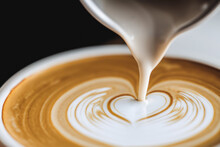 Closeup Of Latte Art Being Poured