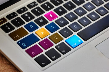 Poster - Laptop, keyboard button and color tech in closeup on internet, website or information on table. Digital, computer and electronic pc on desk for work, email or networking in futuristic key or hardware