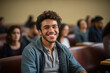 © Julia Jones - A young Latin American man is sitting at a college lecture