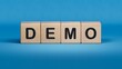 © feng - Demo. Cubes form the word Demo. An extensive concept of the word demo applied in different fields of activity.3D rendering on blue background.