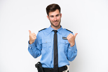 Wall Mural - Young police caucasian man isolated on white background with thumbs up gesture and smiling