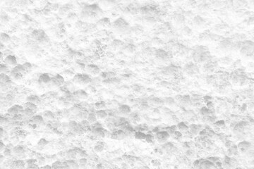 White wall surface of the white stone texture rough, gray tone. Use this for wallpaper or background image rock backdrop. There is a blank space for text.