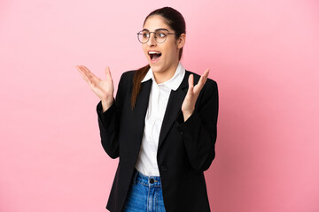 Wall Mural - Young caucasian business woman isolated on pink background with surprise facial expression