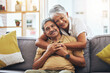© Joshua A/peopleimages.com - Portrait, hug and senior couple on sofa for bonding, healthy marriage and relationship in living room. Retirement, love and happy man and woman on couch embrace for trust, commitment and care at home