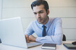 © Eugenio Marongiu - Young millennial indian businessman working office