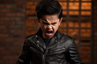 Anger Asian Boy In Black Jacket On Brick Wall Background. Сoncept Anger, Asian Boys, Black Jackets, Brick Wall Backgrounds