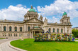 Front view of Belfast City Hall with flowers decorating the word 
