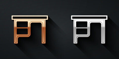 Poster - Gold and silver Office desk icon isolated on black background. Long shadow style. Vector
