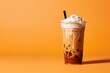 Delicious Iced Cold Brew Coffee with Pumpkin Spice Isolated on a Orange Background
