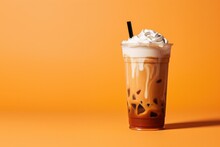 Delicious Iced Cold Brew Coffee With Pumpkin Spice Isolated On A Orange Background