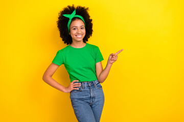 Sticker - Photo of pretty charming lady wear green t-shirt hairband pointing finger empty space isolated yellow color background