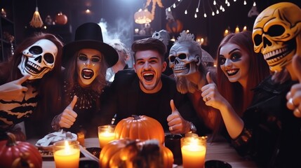 Halloween party. Six friends in costume cine villains posing with skull and pumpkin-lamp at a party. Around them flies confetti. They are having fun and laughing