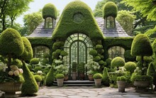 Backyard Greenhouse Featuring Sculpted Topiary Arrangements, Trimmed Hedges, And Bushes Shaped Into Intricate Forms