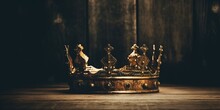 Low Key Image Of Beautiful Queen King Crown Over Wooden Table. Vintage Filtered.