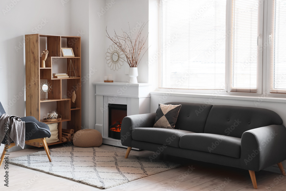 Interior of modern living room with stylish fireplace and sofa