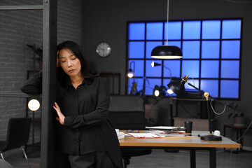 Sticker - Tired Asian businesswoman in office at late evening