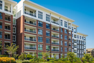 Brand new apartment building on summer. Canadian modern residential architecture. Modern complex of apartment buildings