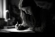 © Anne Schaum - Black and white portrait of a young woman writing in a notebook.